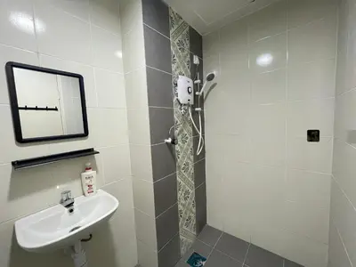 a bathroom with a sink and a mirror at The Anderson Ipoh Town in Ipoh