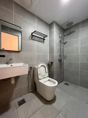 a bathroom with a toilet and a sink at ICC Suites Ipoh Walking distance to Mall in Ipoh