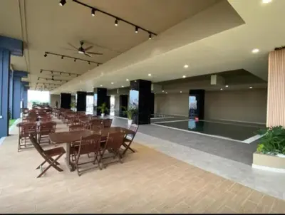 a large room with a long table and chairs at ICC Suites Ipoh Walking distance to Mall in Ipoh