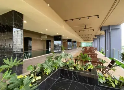 a lobby of a building with plants and chairs at ICC Suites Ipoh Walking distance to Mall in Ipoh