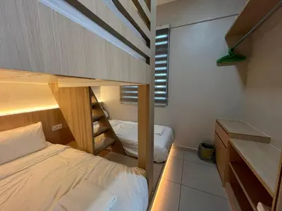 a small room with a bed and a bunk bed at PrimaStay Ipoh Palo for 7 Pax in Ipoh