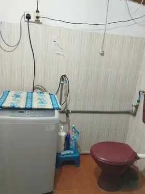 a small bathroom with a toilet and a shower at Inap Desa Jalan Baru in Kampong Sedim Number Two