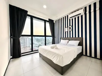 a bedroom with a bed and a large window at Classic House In Georgetown 3br 10pax in George Town