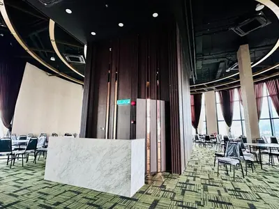 a room with chairs and a table in a building at Island Sea & City View Familystay 3BR 10Pax in George Town