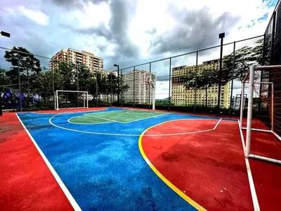 a basketball court with a basketball hoop on it at Peaceful Abode Familystay 3 br 10 pax in George Town