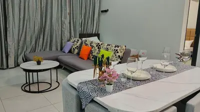a living room with a couch and a table at Peaceful Abode Familystay 3 br 10 pax in George Town