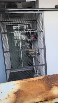 a bird cage with a bird inside of it at comfy soho in Seri Iskandar
