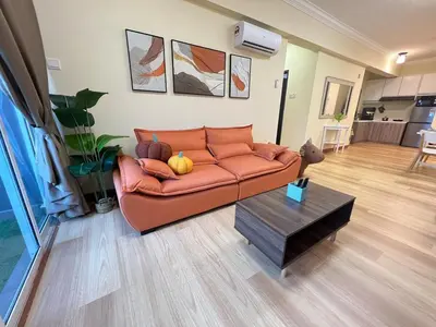 a living room with a couch and a table at G Home 2 - Ipoh City Centre The Majestic 2R2B in Ipoh