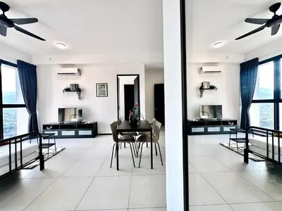 a living room with a table and chairs and windows at Royal Luxury apartment in Georgetown 3BR 10PAX in George Town