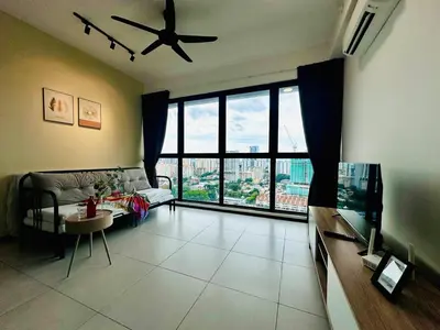a living room with a couch and a ceiling fan at cozy family stay suites apartment 3br 10 pax in George Town