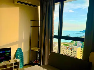 a hotel room with a view of a city from a window at 15 min airport to apartment 3br 10pax in George Town