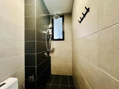 a small bathroom with a shower and a window at Near komtar apartment in goergetown 3br 10 pax in George Town