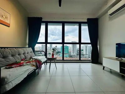a living room with a large window with a view at Near komtar apartment in goergetown 3br 10 pax in George Town