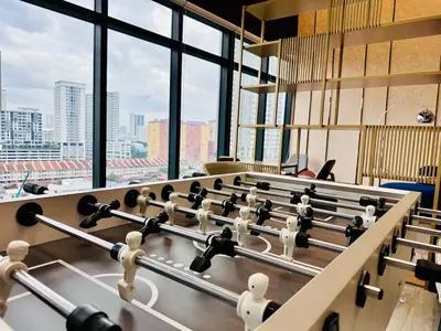 a row of tables in a room with windows at Rooftop Penang View & infinity pool suite apartment 3br 10 pax in George Town