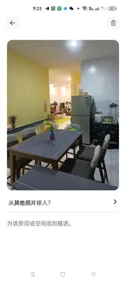 a room with a table and chairs and a refrigerator at HEE & PENNIE House in Ipoh