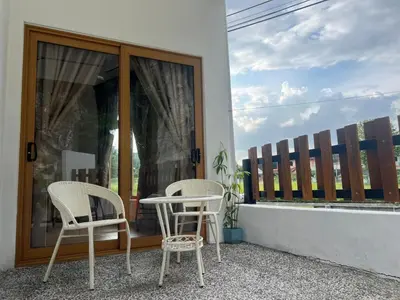 two chairs and a table on a balcony at Hillview Ipoh in Ipoh
