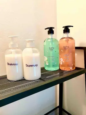 three bottles of detergent sitting on a shelf at Ipoh Garden Canning Very Near Food Desire Homestay in Ipoh