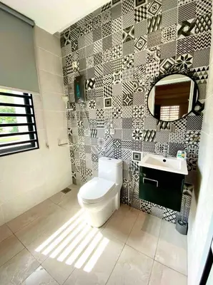 a bathroom with a toilet and a sink at Ipoh Garden Canning Very Near Food Desire Homestay in Ipoh