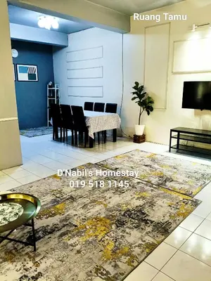 a living room with a table and chairs and a rug at D Nabils Homestay Musslim Sahaja in Kulim
