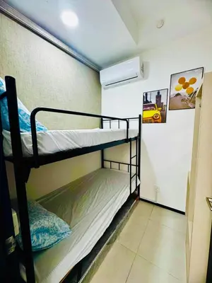 a room with two bunk beds in a room at Luxury Suites with Sea & City Views 3BR 12PAX in Jelutong