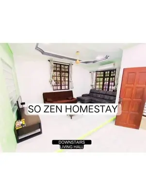 a room with a bed and a door in a room at So Zen Homestay in Taiping