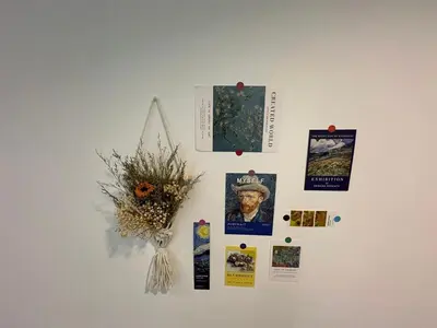 a white wall with pictures and a vase of flowers on it at Joyful Seaview Studio 118 Island88 for 3pax in George Town