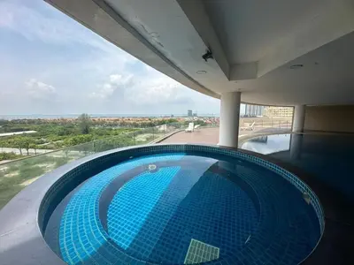 a swimming pool in a building with a view of the ocean at Joyful Seaview Studio 118 Island88 for 3pax in George Town