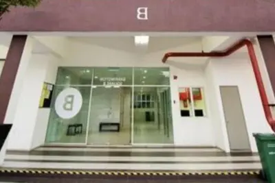 a lobby of a building with a bench in it at Cahaya homestay Penthouse Cameron Highlands in Brinchang