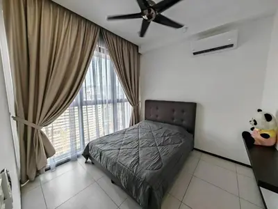 a bedroom with a bed and a ceiling fan at Penang Urban Homestay in Jelutong
