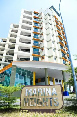 a building with a marina heights sign in front of it at 3B2BR Marina Height Family Room Sea View Room in Lumut