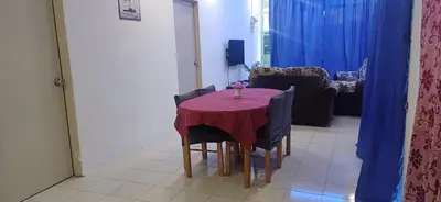 a dining room table with a red table cloth on it at River Truss Homestay in Nibung Tebal