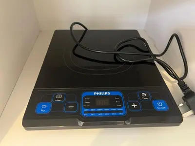 a electronic device with a cord on a table at Omari 2 Marina Island Homestay Lumut in Lumut