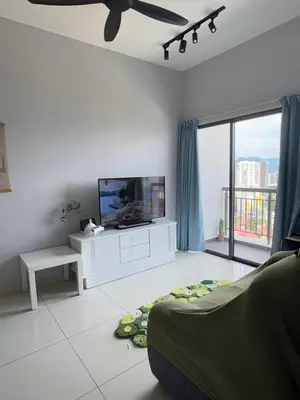 a white living room with a tv and a couch at The Horizon - Ipoh' Rachel in Ipoh