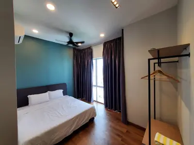 a bedroom with a white bed and a blue wall at Sekinchan Kent's House with wide paddy view in Sekincan