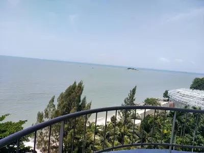 a view of the ocean from a balcony at Seaview appointment 3 bedroom in Tanjung Bungah