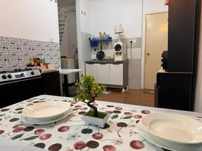 a kitchen with a table with two plates on it at charming 1br retreat in bayan lepas 1car park Malaysian guest only Netflix in Bayan Lepas