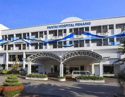 a large white building with blue bows on it at charming 1br retreat in bayan lepas 1car park Malaysian guest only Netflix in Bayan Lepas