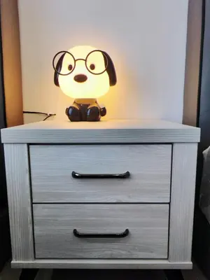 a dresser with a lamp on top of it at Do not book in Ipoh