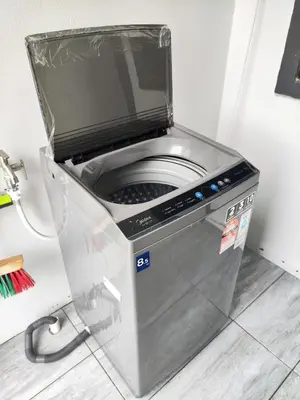 a washing machine in a corner of a room at Do not book in Ipoh