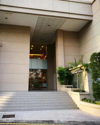 a building with stairs in front of a building at Comfort 1BR studio One One Eight Island Plaza in Tanjong Tokong