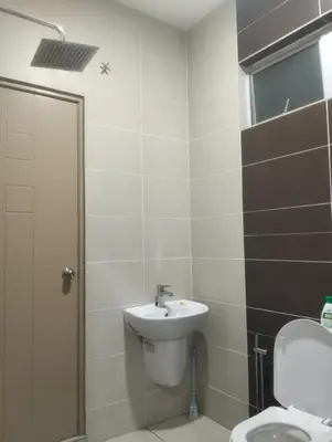 a bathroom with a sink and a toilet at Tenang Tambun House in Tanjung Rambutan