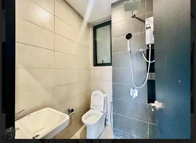 a small bathroom with a toilet and a sink at Spacious 3BR Retreat Comfort & Style in the City 2-10pax in Jelutong