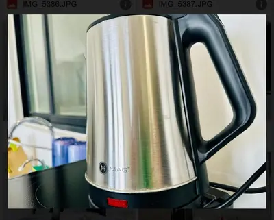 a metal tea kettle sitting on top of a stove at Spacious 3BR Retreat Comfort & Style in the City 2-10pax in Jelutong