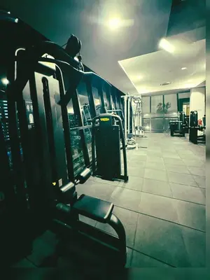 a gym with a bench in a gym at Modern 3BR Getaway Perfect for Families & Groups 10 pax in Jelutong