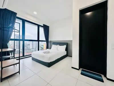 a bedroom with a bed and a large window at Spacious 3BR Retreat Comfort & Convenience in Prime Location 2-10pax in Jelutong