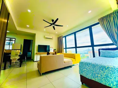 a bedroom with a bed and a ceiling fan at Perfect for Groups! 2BR with 5 Queen Beds & WiFi in Jelutong