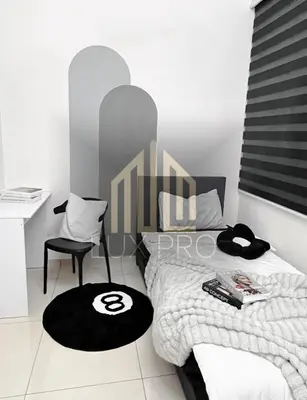 a bedroom with a bed and a desk and a chair at Residensi prima kampung paloh in Ipoh