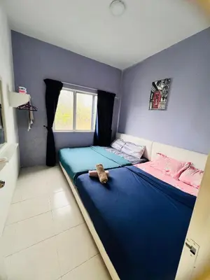 a bedroom with a bed with a stuffed animal on it at Rayyan'Homestay PRIMA in Tanah Rata