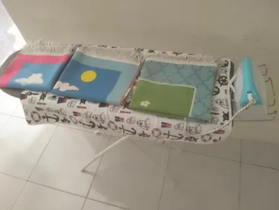 a table with books on top of it at Homestay Panda Seri Iskandar Location nearby Uitm Utp KPM in Seri Iskandar