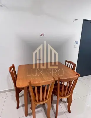 a dining room table with four chairs in a room at Residensi prima kampung paloh in Ipoh
